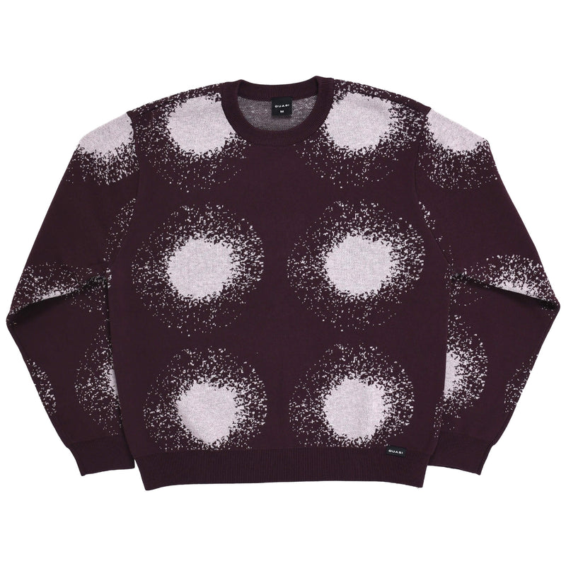 Sweater with white circular pattern on a white background