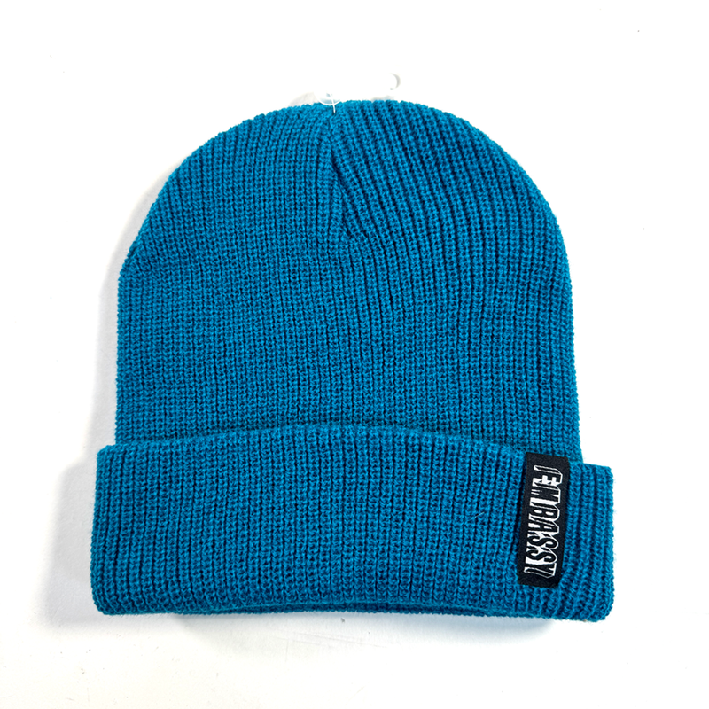 Electric Blue Beanie on white background featuring a woven Embassy Logo 