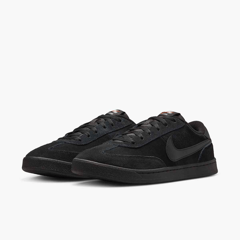 Black Nike sneakers on a white background