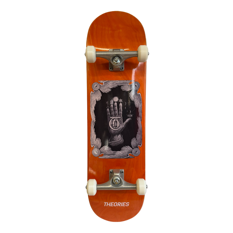 Skateboard with a wooden deck featuring artwork and 'THEORIES' branding on a white background.