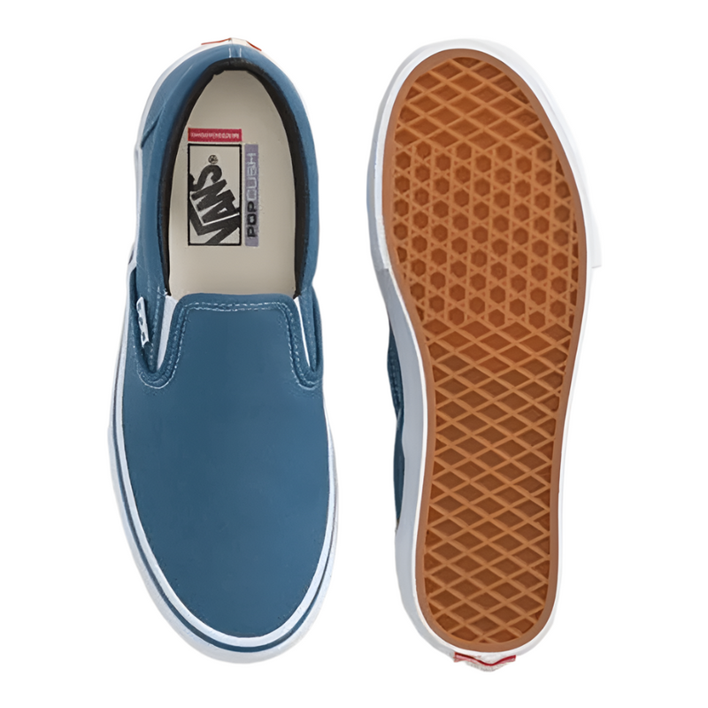 Blue slip-on sneaker with brown sole on a light gray background