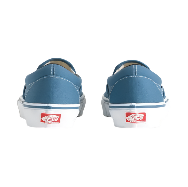 Blue Vans shoes with white soles on a light gray background